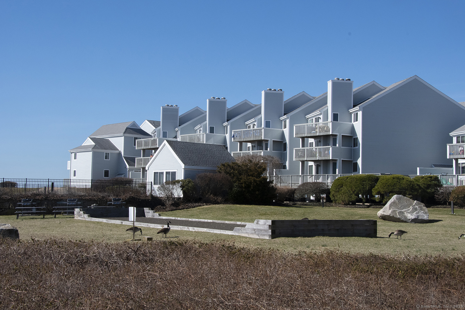 1 Mansfield Grove Road, Unit 306 East Haven, CT 06512 - Photo 4 of 31 a front view of a house with a yard