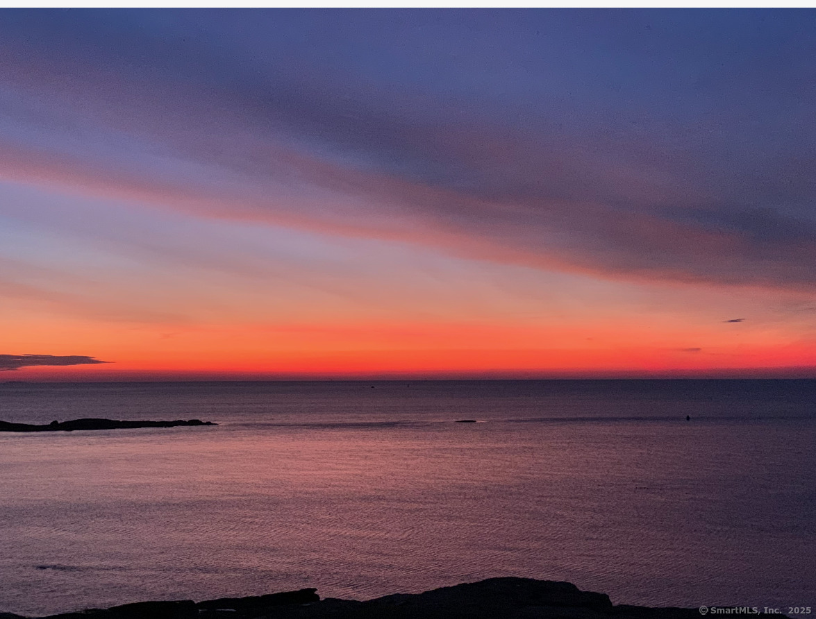 1 Mansfield Grove Road, Unit 306 East Haven, CT 06512 - Photo 6 of 31 a sunset view with a lake