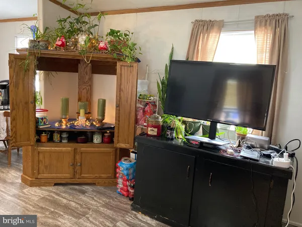 a kitchen view of a living room