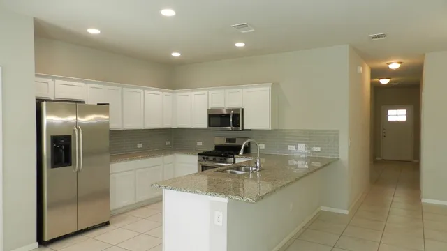 a bathroom with a sink a large mirror and a shower