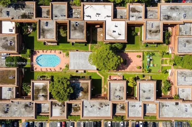 a garden view with a swimming pool