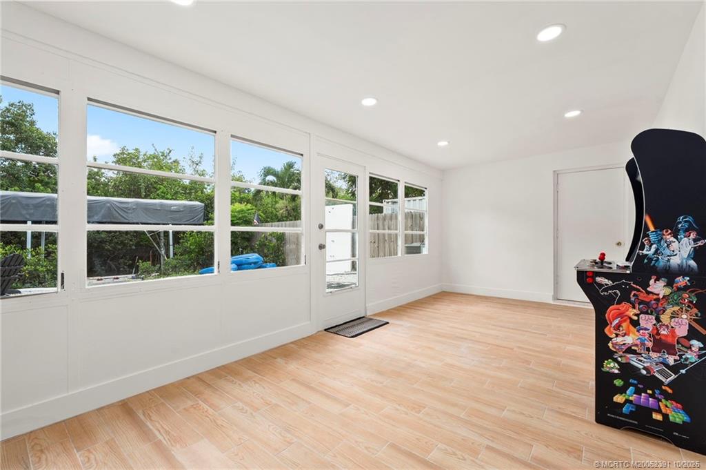 30 Southwest Hideaway Place Stuart, FL 34994 - Photo 14 of 45 a view of an empty room with a window and wooden floor