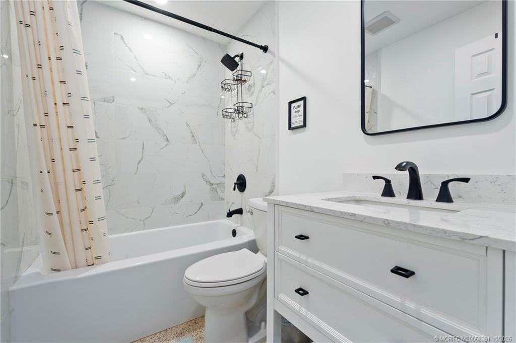 30 Southwest Hideaway Place Stuart, FL 34994 - Photo 18 of 45 a bathroom with a sink a toilet and shower