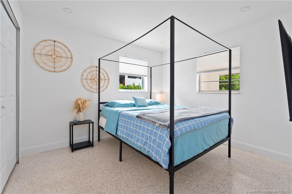 30 Southwest Hideaway Place Stuart, FL 34994 - Photo 19 of 45 a bed room with a bed and a window