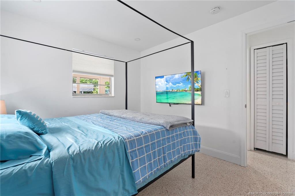 30 Southwest Hideaway Place Stuart, FL 34994 - Photo 20 of 45 a bedroom with a bed and a window