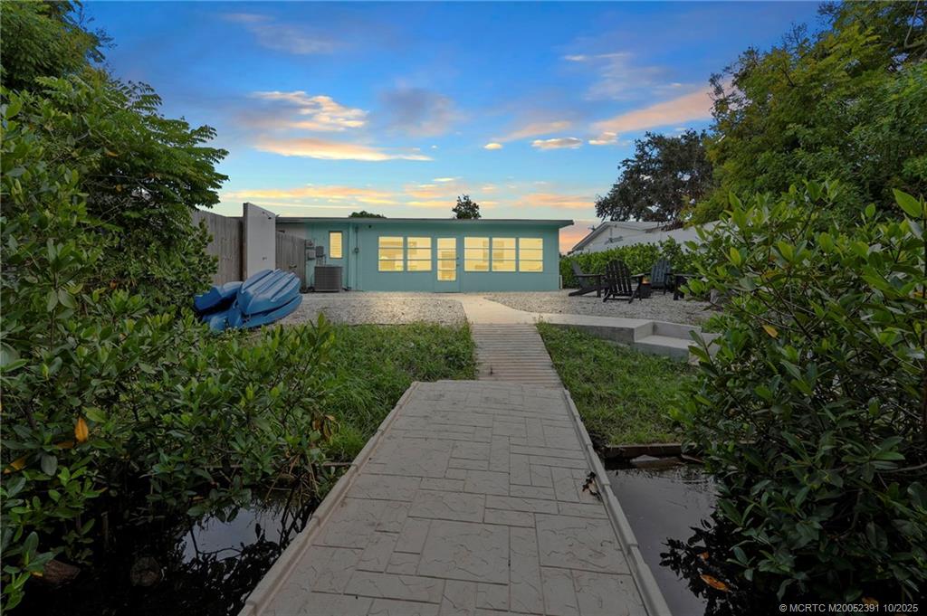 30 Southwest Hideaway Place Stuart, FL 34994 - Photo 2 of 45 a view of a pathway with a garden