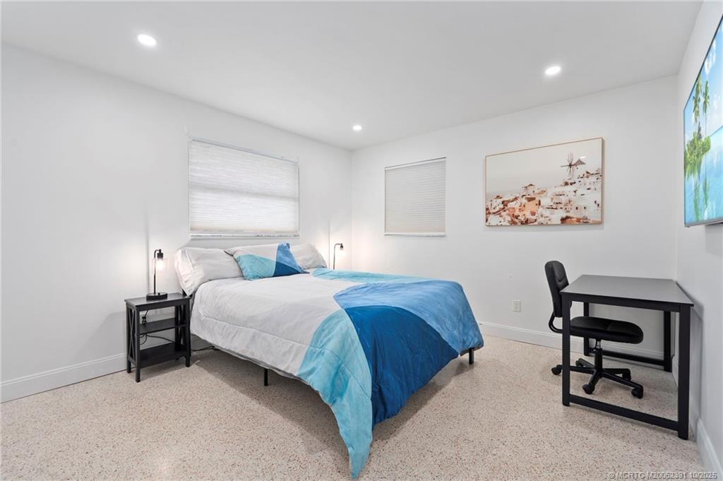 30 Southwest Hideaway Place Stuart, FL 34994 - Photo 21 of 45 a bedroom with a bed and a dresser