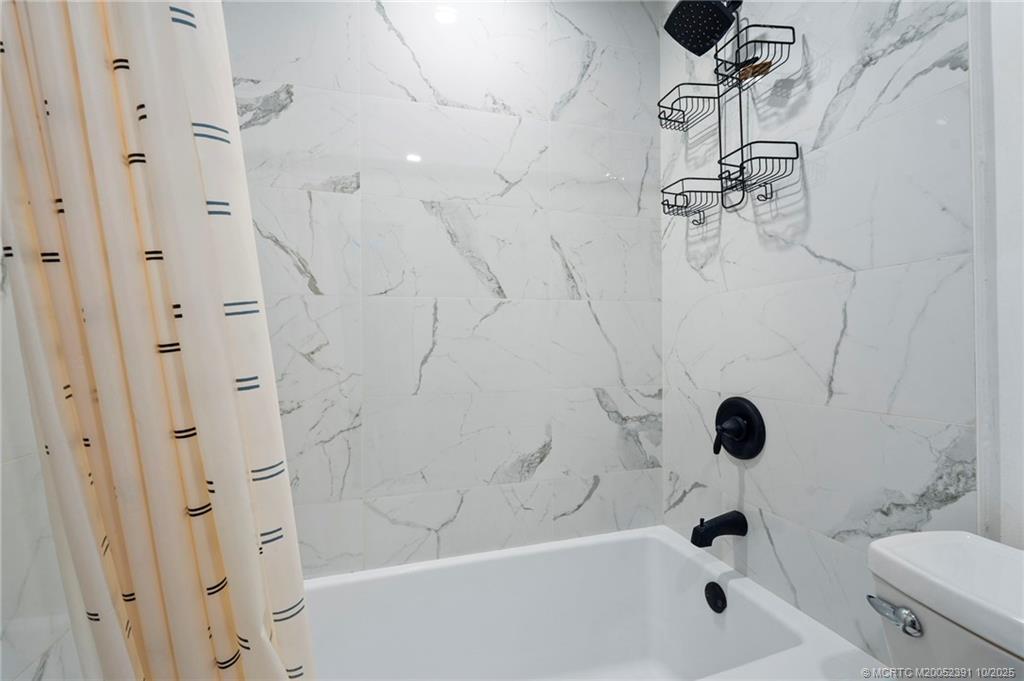 30 Southwest Hideaway Place Stuart, FL 34994 - Photo 22 of 45 a bathroom with a shower and a toilet