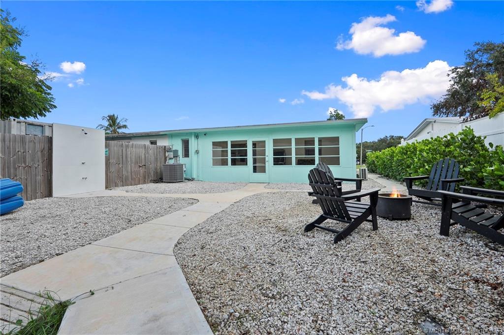 30 Southwest Hideaway Place Stuart, FL 34994 - Photo 26 of 45 a view of a house with backyard and sitting area