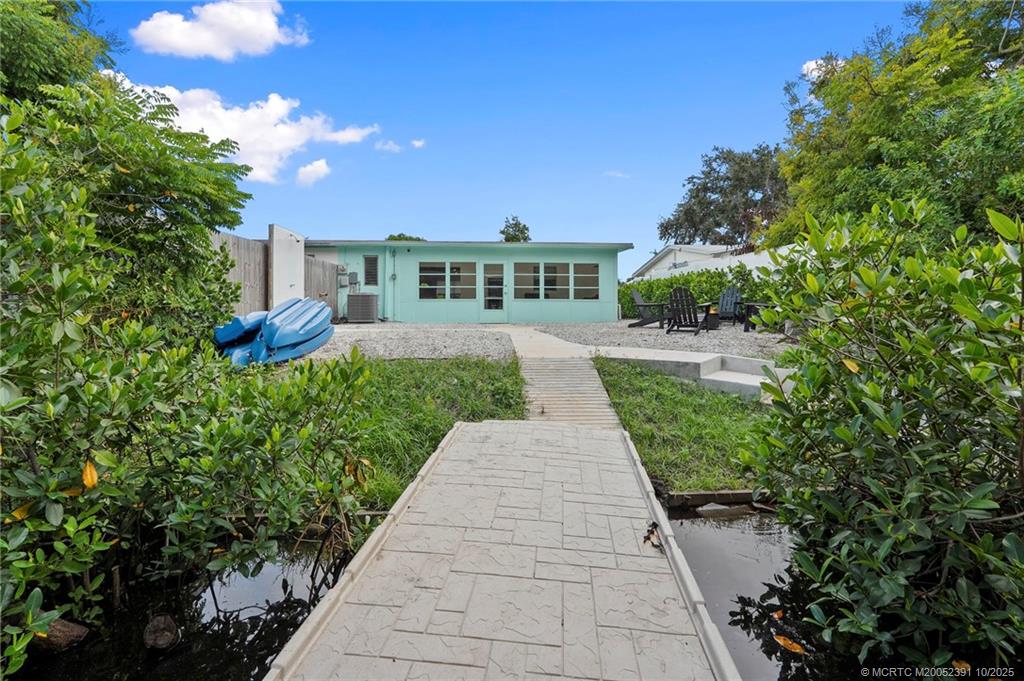 30 Southwest Hideaway Place Stuart, FL 34994 - Photo 28 of 45 a view of a pathway with a house