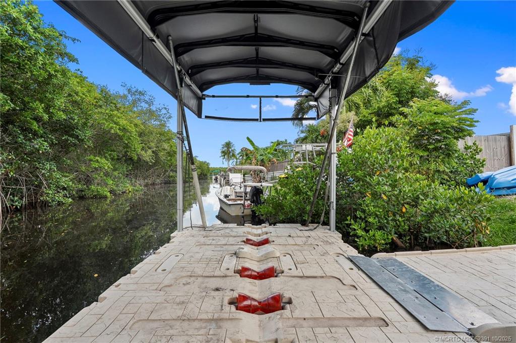 30 Southwest Hideaway Place Stuart, FL 34994 - Photo 31 of 45 a view of a backyard of the house