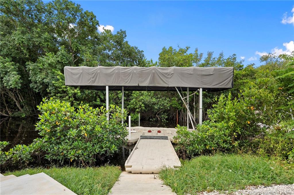 30 Southwest Hideaway Place Stuart, FL 34994 - Photo 35 of 45 a view of a back yard with green space