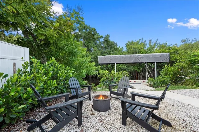 swimming pool view with a seating space