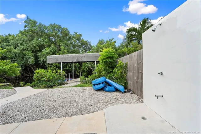 a view of a backyard with a patio