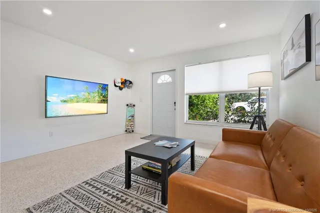 a living room with furniture and a rug