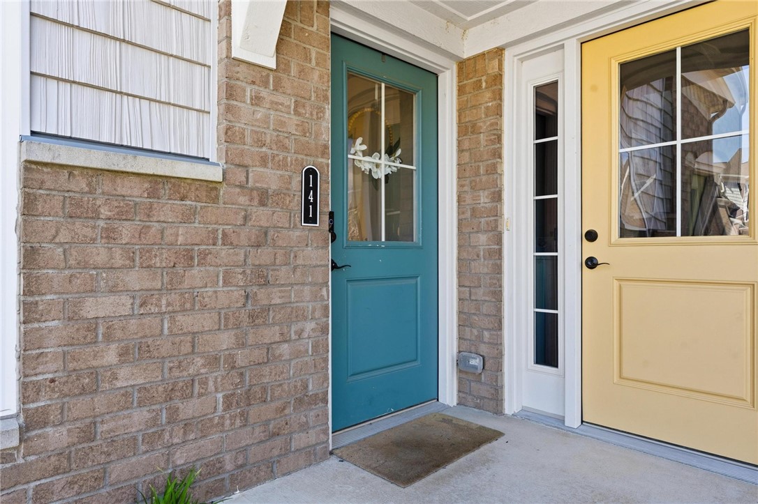 141 Old Pond Road Springboro, OH 45066 - Photo 2 of 20 This inviting turquoise entry door opens to the foyer before stepping down to the lower level.
