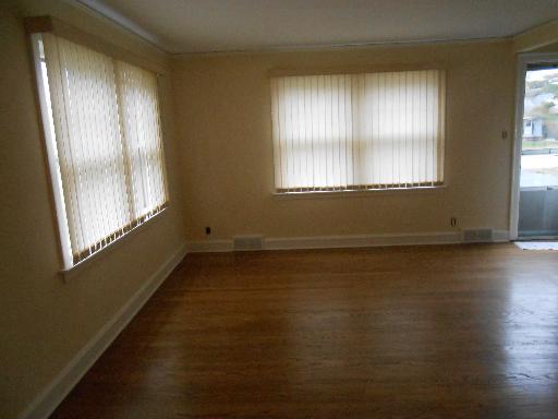 2936 Birch Road Homewood, IL 60430 - Photo 11 of 11 a view of an empty room with wooden floor and a window