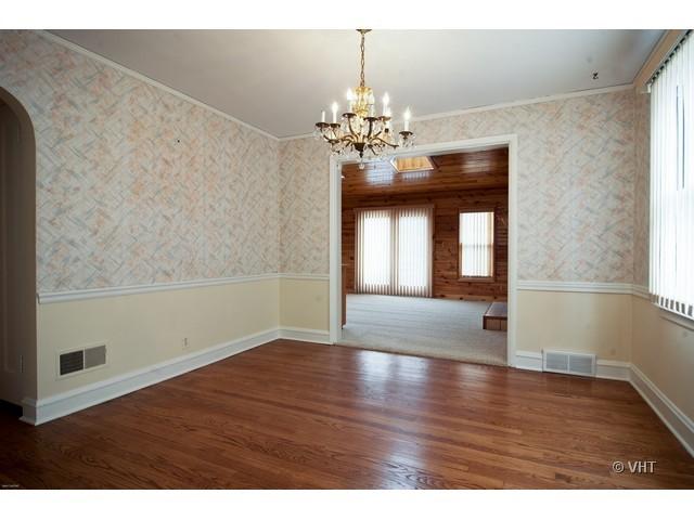 2936 Birch Road Homewood, IL 60430 - Photo 4 of 11 a view of a room with wooden floor and chandelier
