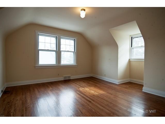 2936 Birch Road Homewood, IL 60430 - Photo 8 of 11 a view of an empty room with wooden floor and a window
