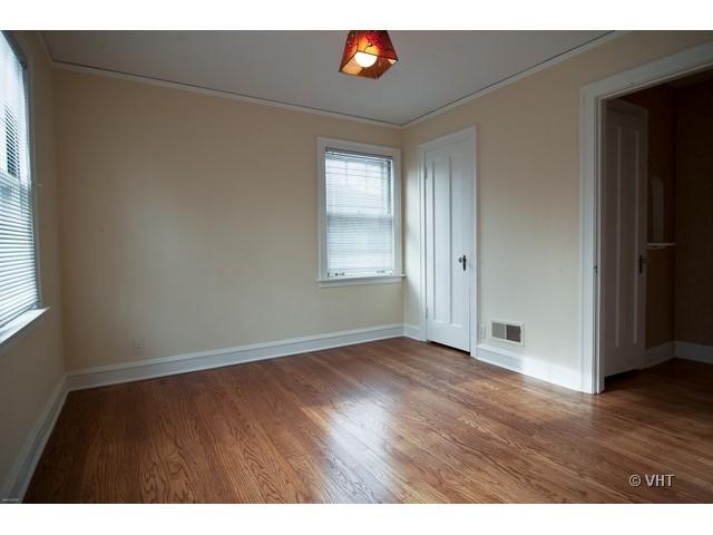 2936 Birch Road Homewood, IL 60430 - Photo 9 of 11 a view of an empty room with wooden floor and a window
