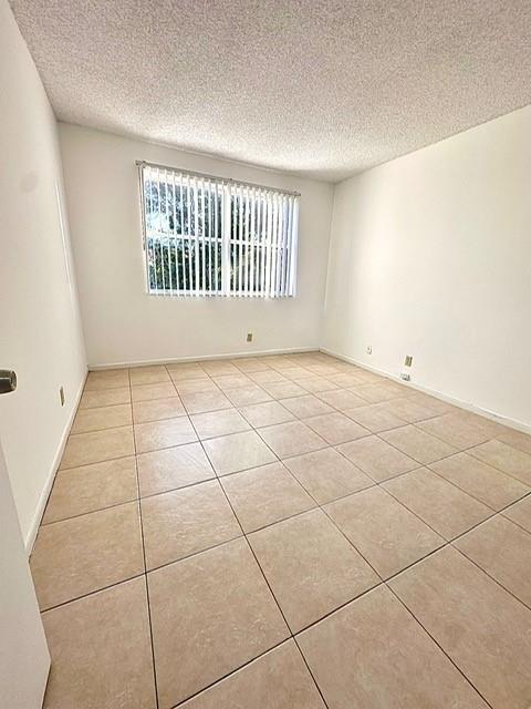 9033 Wiles Road, Unit 304 Coral Springs, FL 33067 - Photo 10 of 12 a view of a livingroom with a window