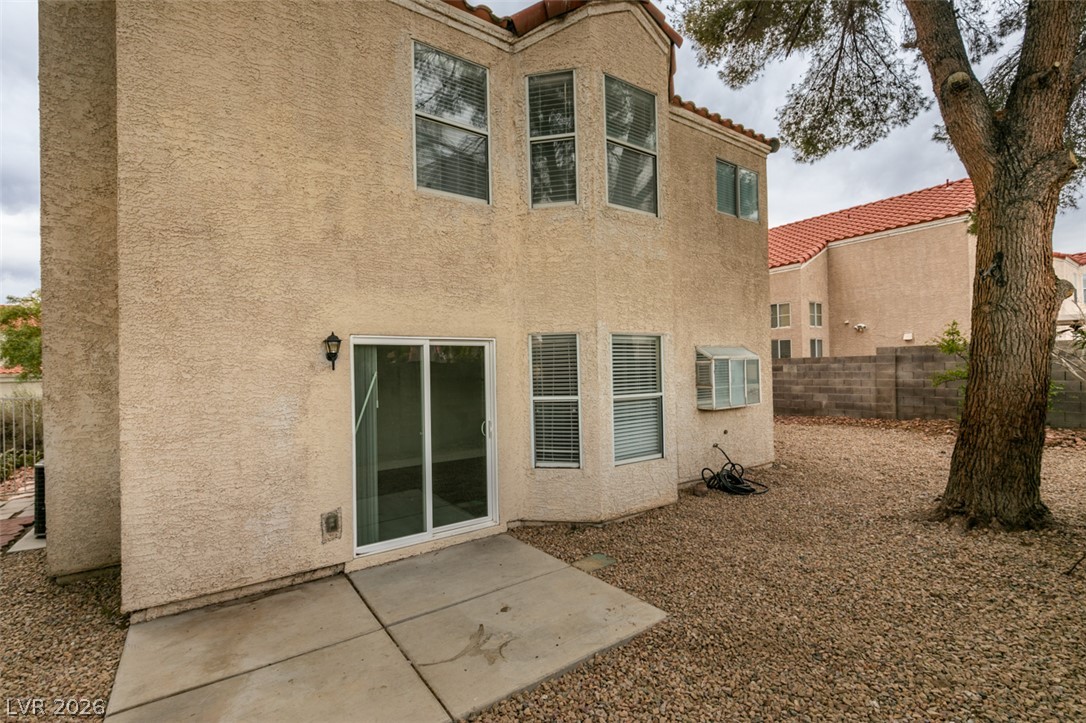 1738 Toltec Circle Henderson, NV 89014 - Photo 5 of 46 Backyard with a practical patio, providing convenient outdoor access.