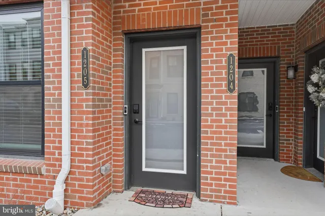 a view of a wooden door of the house