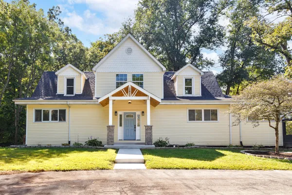 a front view of a house with a yard