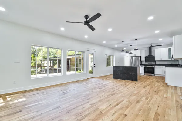 a view of kitchen with sink and wooden floor