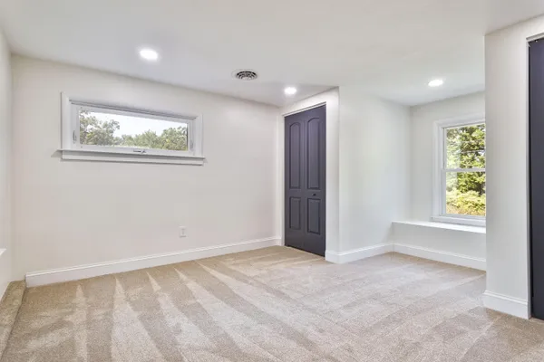 a view of an empty room and window