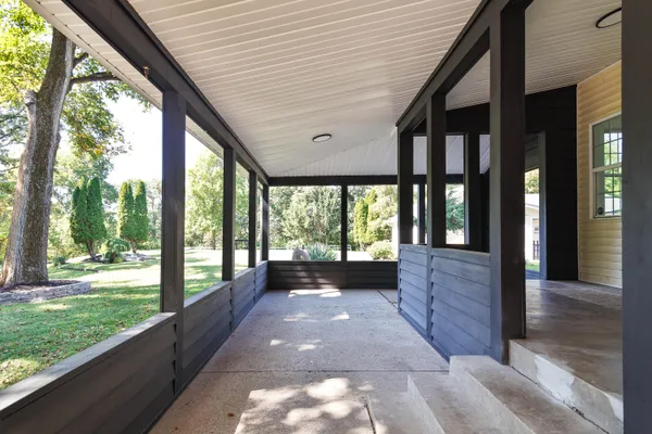 a view of porch with a bench in balcony