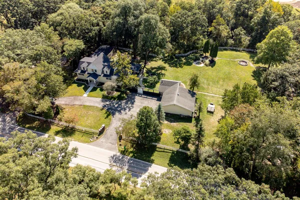 an aerial view of residential house with outdoor space