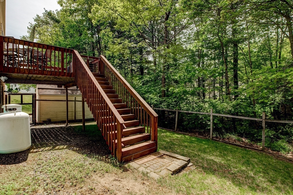 6 Loon Road Winchendon, MA 01475 - Photo 30 of 36 a backyard of a house with wooden deck and furniture