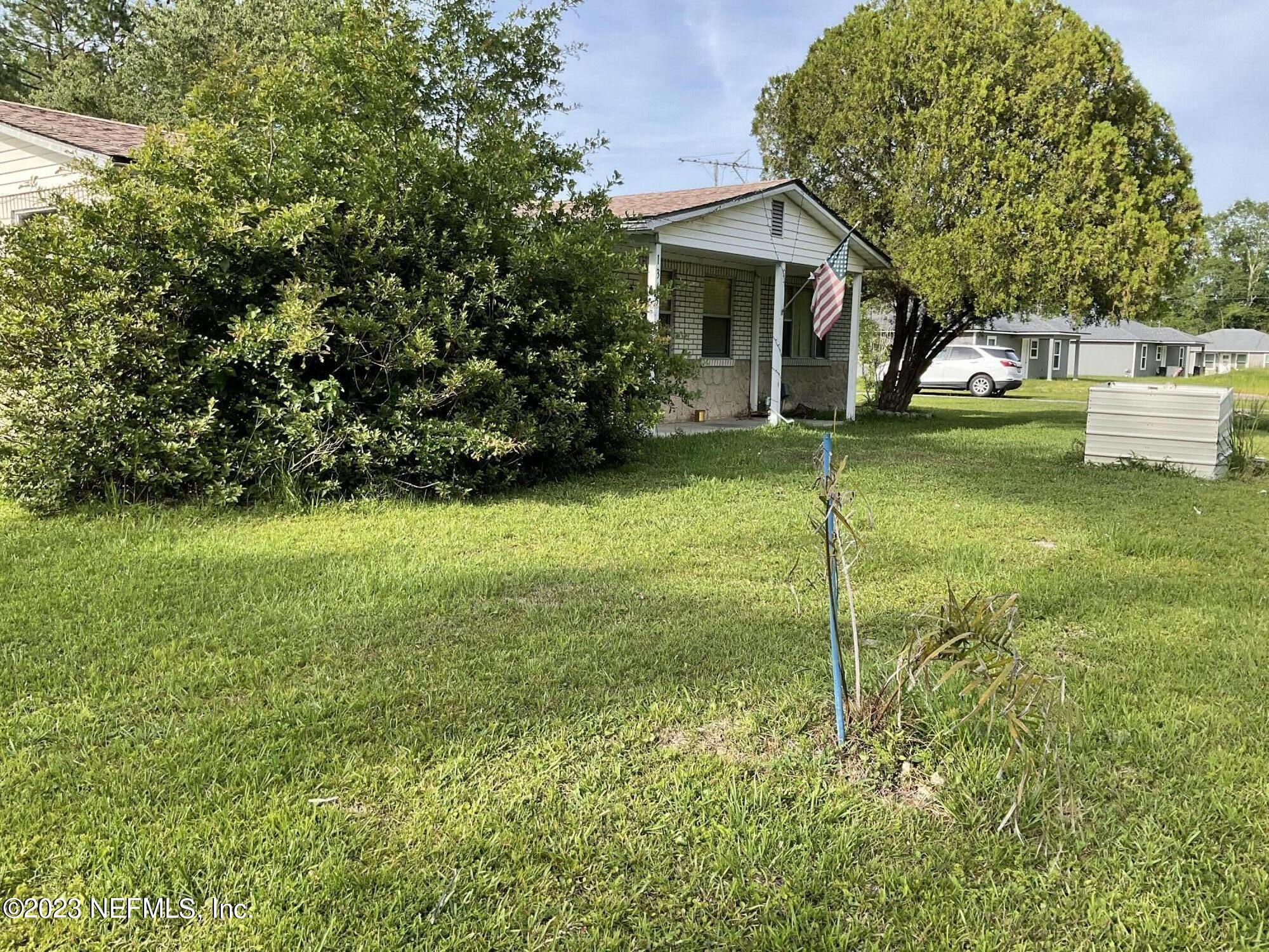 1365 US 90 Macclenny, FL 32063 - Photo 2 of 16 a front view of a house with garden