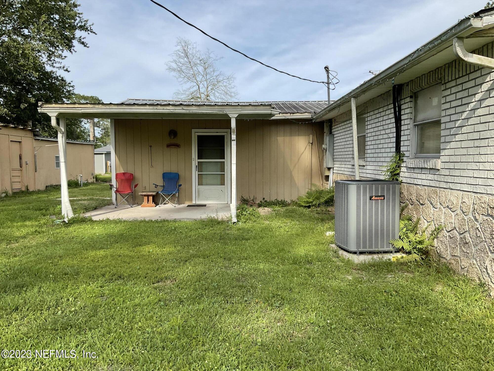 1365 US 90 Macclenny, FL 32063 - Photo 5 of 16 a front view of a house with a yard