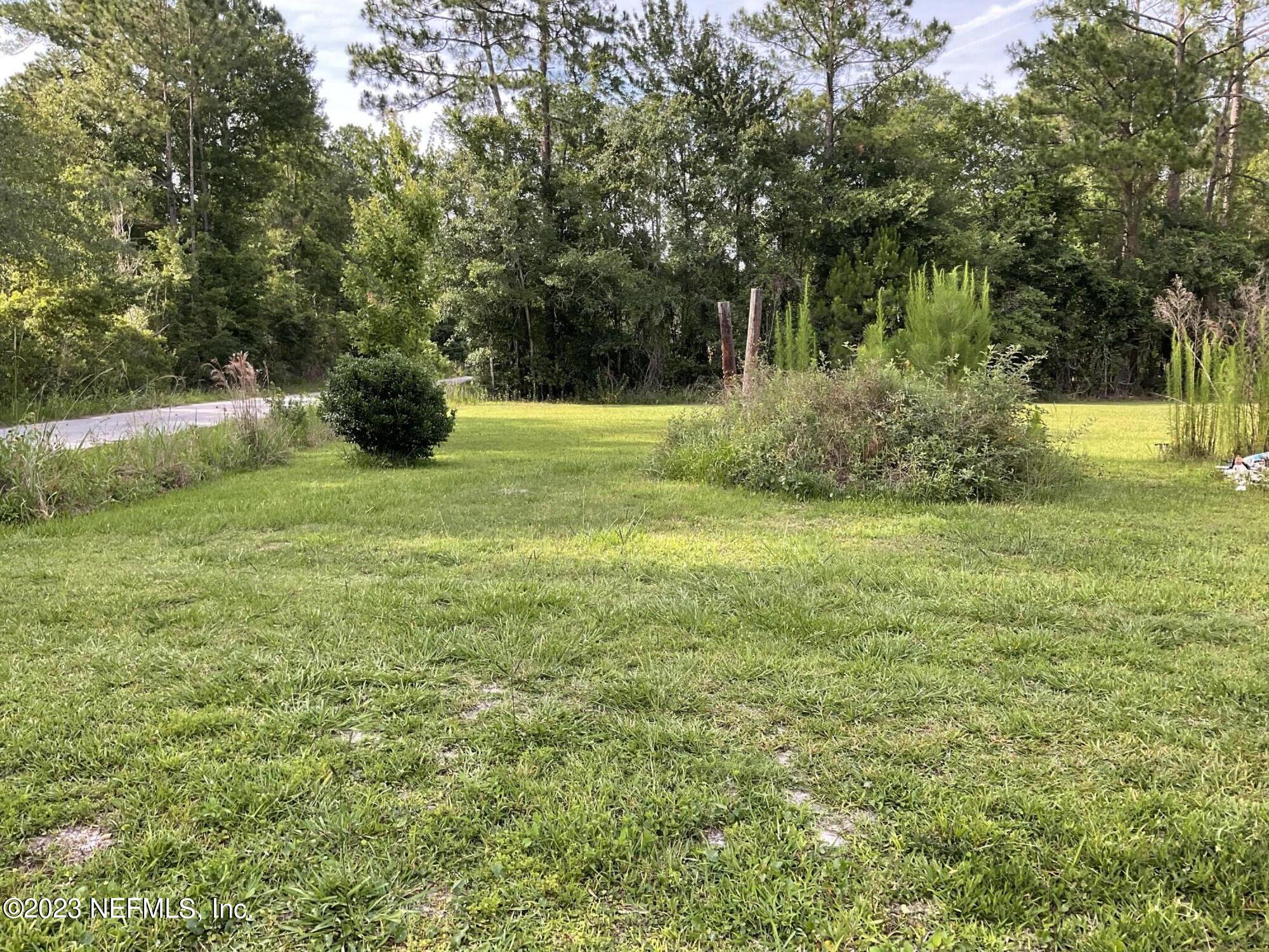 1365 US 90 Macclenny, FL 32063 - Photo 8 of 16 a view of outdoor space with garden and trees