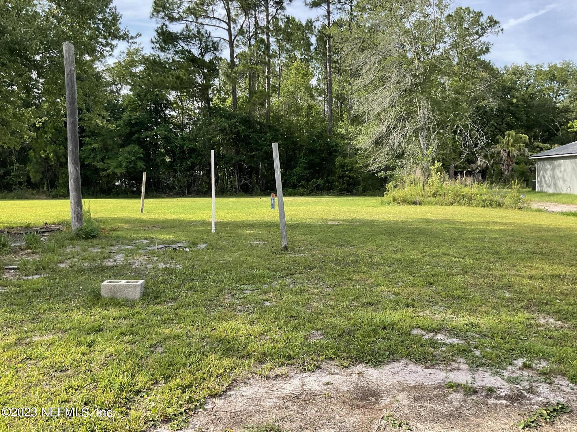 1365 US 90 Macclenny, FL 32063 - Photo 10 of 16 a view of a swimming pool with a yard