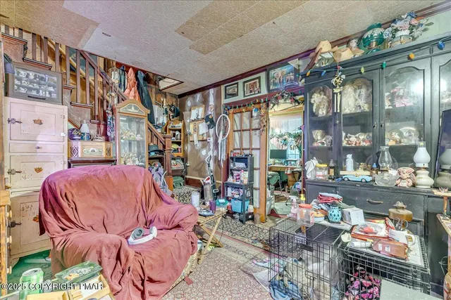 a couch sitting in a living room next to a window