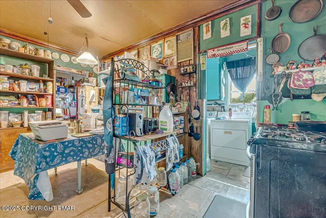 a stove top oven sitting inside of a kitchen