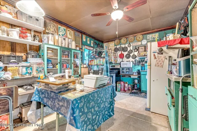 a bathroom with a sink mirror vanity and toilet