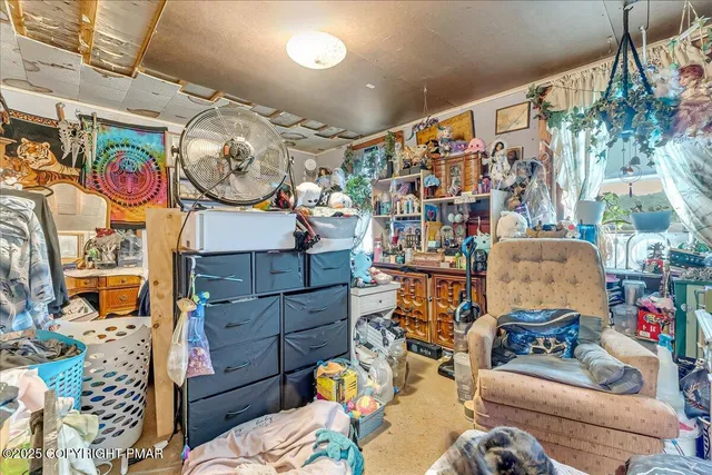 a view of livingroom with furniture and toys