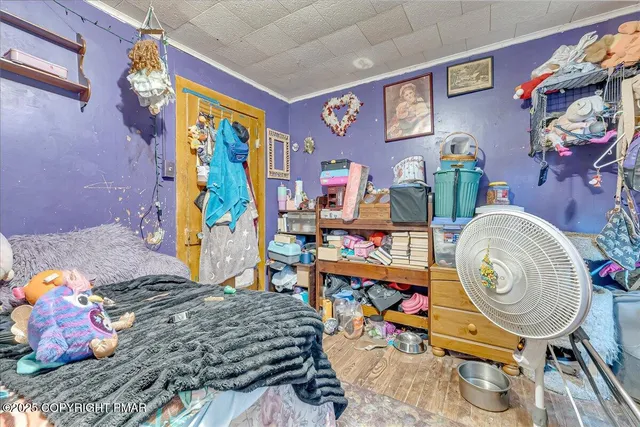 a bathroom with a toilet and a shower curtain
