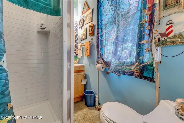 a view of house with a yard and sitting area