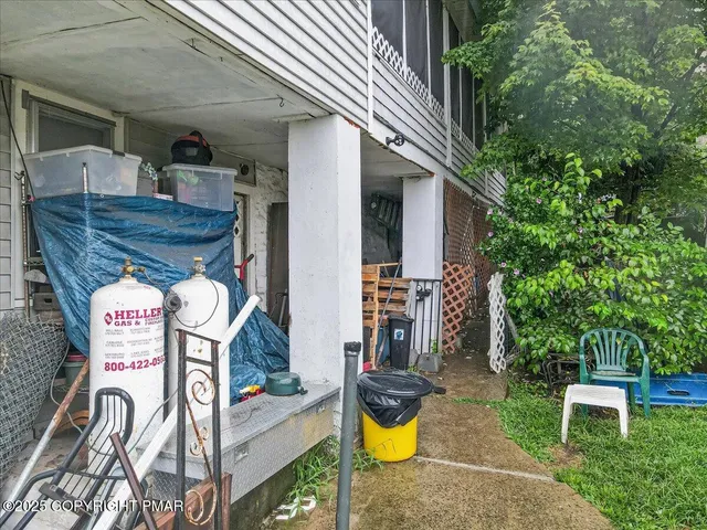 an aerial view of a house with swimming pool garden and balcony