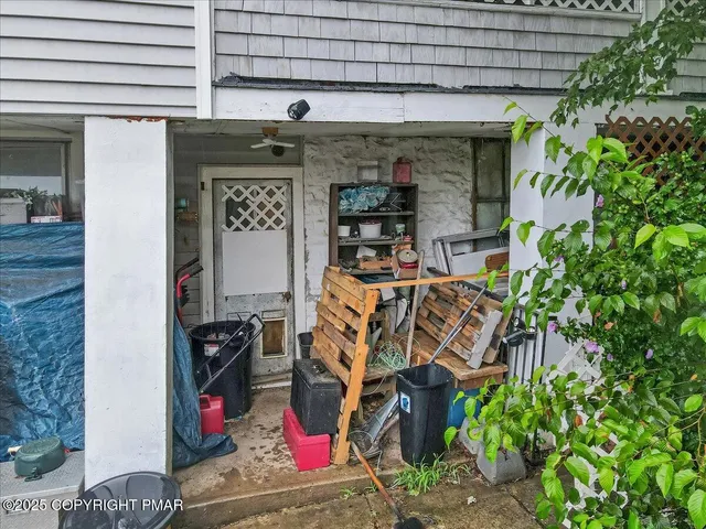 an aerial view of a house with a garden and plants
