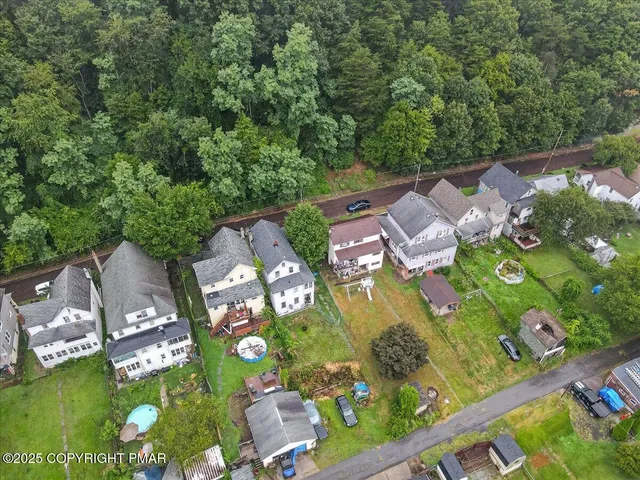 a picture of a bench in front of a building
