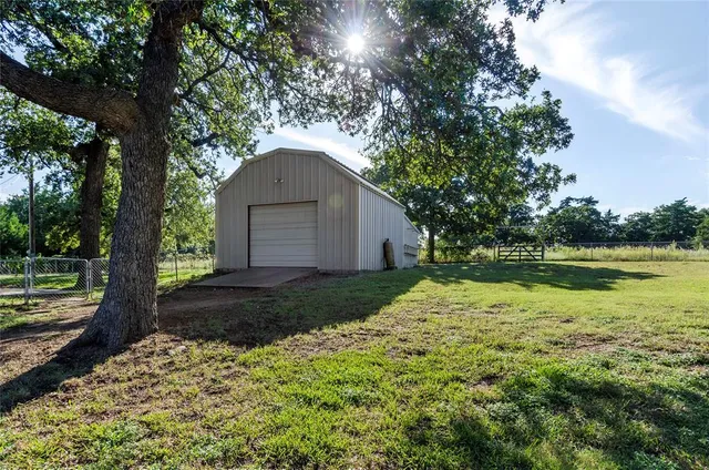 a backyard of a house with lots of green space