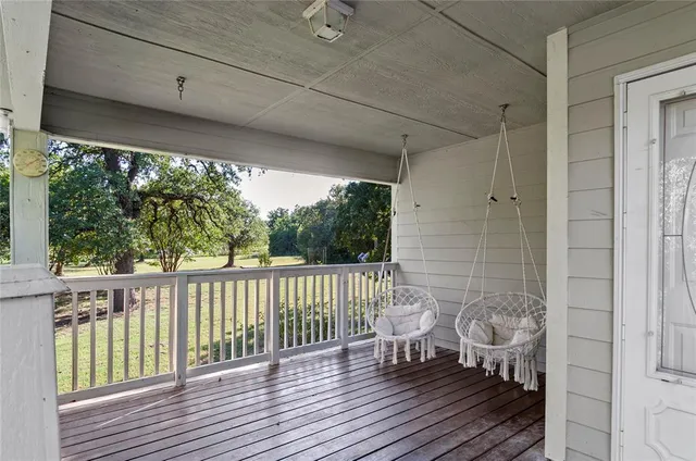 a view of balcony with wooden floor