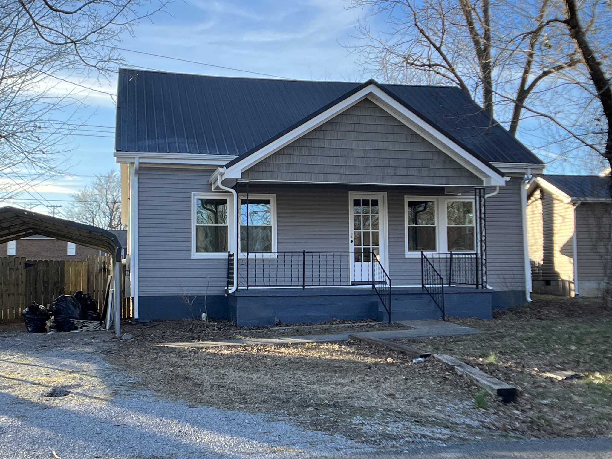 124 Arnold Lane Murfreesboro, TN 37127 - Photo 2 of 14 a front view of a house with garden