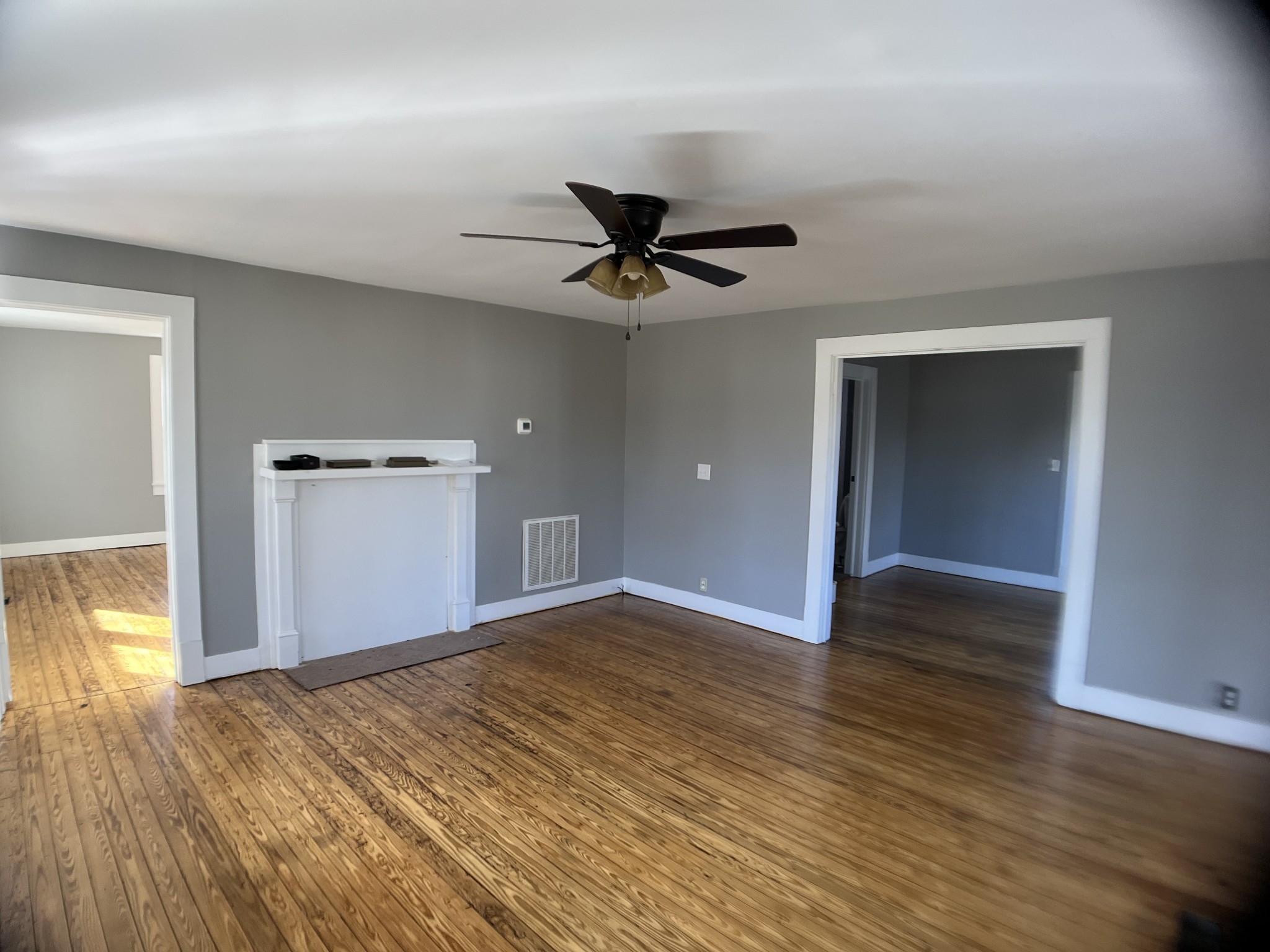 124 Arnold Lane Murfreesboro, TN 37127 - Photo 3 of 14 a view of empty room with wooden floor and ceiling fan